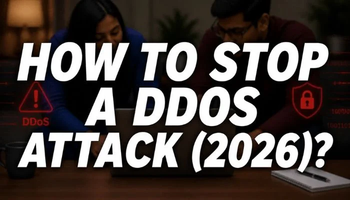 blurred couple using laptop with DDoS warning and security icons with text “How to Stop a DDoS Attack (2026)?”