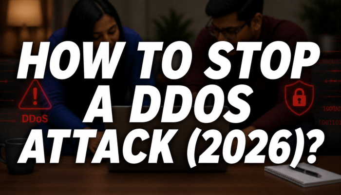 blurred couple using laptop with DDoS warning and security icons with text “How to Stop a DDoS Attack (2026)?”